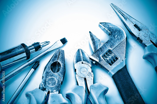 Set of manual tools on a blue background photo