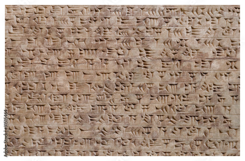 Ancient assyrian clay tablet with cuneiform writing photo