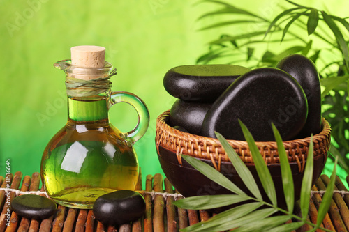 Photography Spa still life with hot stones and essential oil