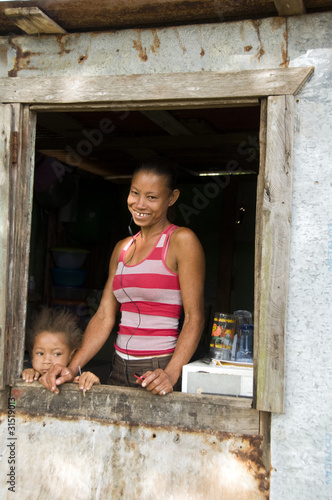 Obraz na płótnie Nicaragua mother daughter  smiling poverty house Corn Island