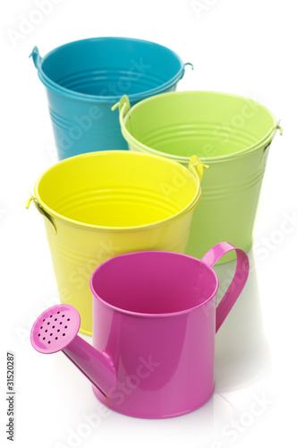 Colorful buckets and watering can