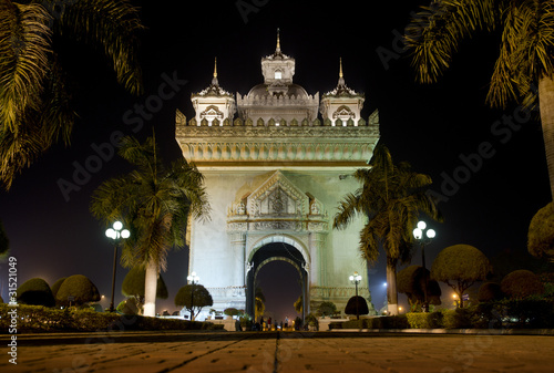 patuxai arch at night in vientiane, laos photo