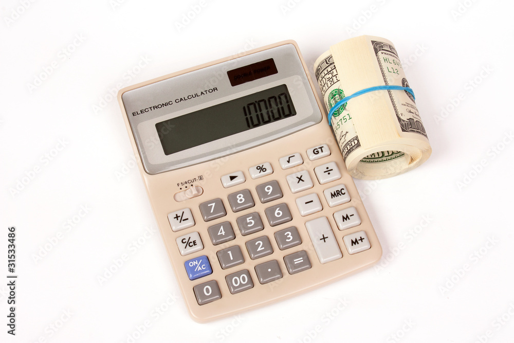 Calculator and one roll from dollars isolated on white Calculator and one roll from dollars isolated on white