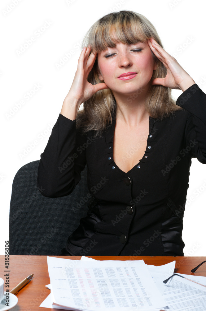 Headache. The business woman on the workplace tired of work Headache. The business woman on the workplace tired of work