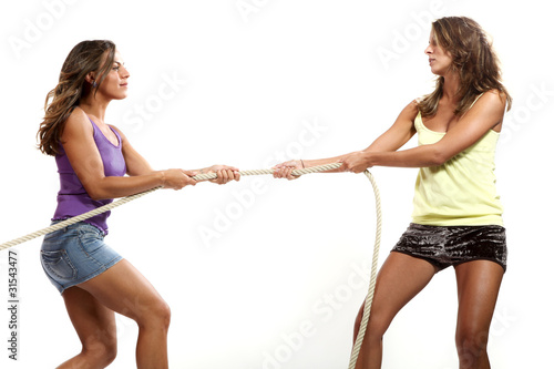 two girls pull the rope