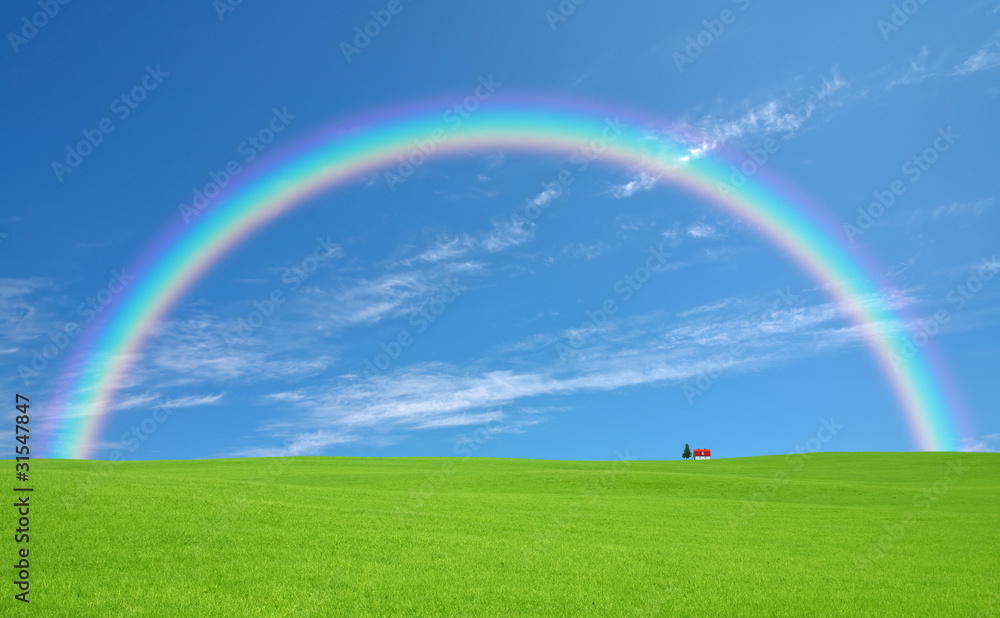 Green grass and red roof house and rainbow Green grass and red roof house and rainbow