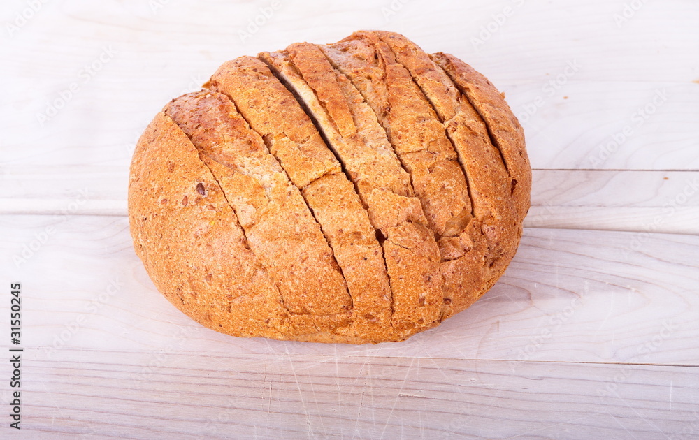Crusty Sliced Bread on a Cutting Board Crusty Sliced Bread on a Cutting Board