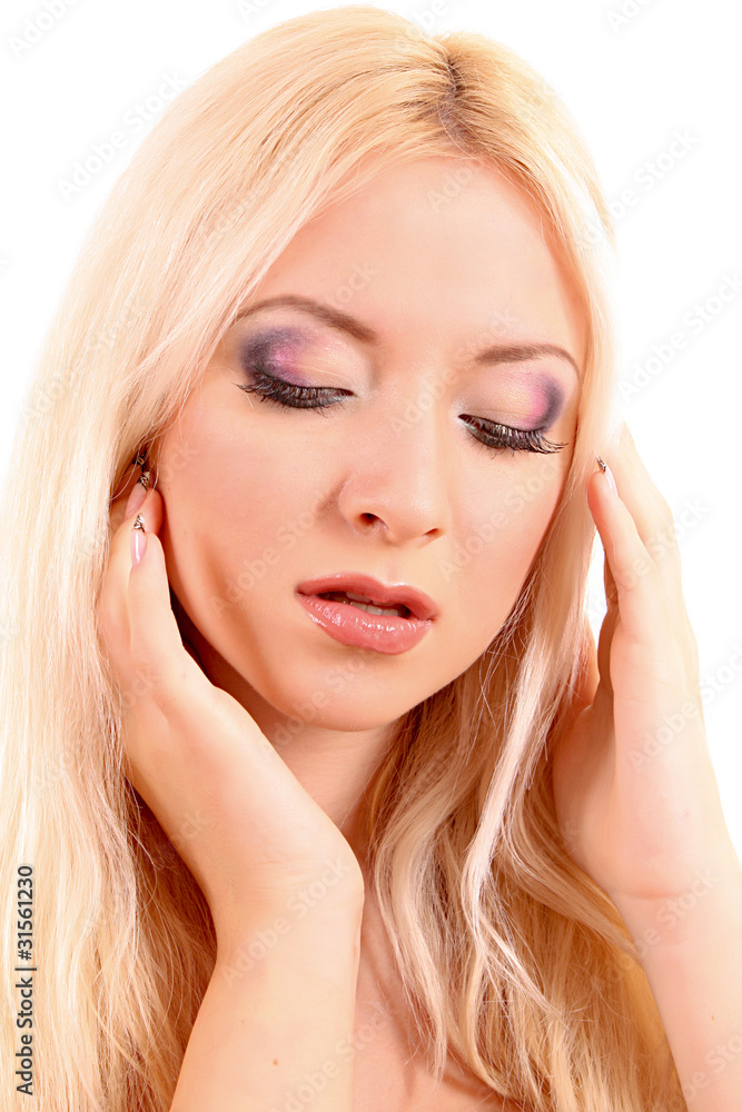 Young beautiful blond woman with the hands near her head isolate Young beautiful blond woman with the hands near her head isolate