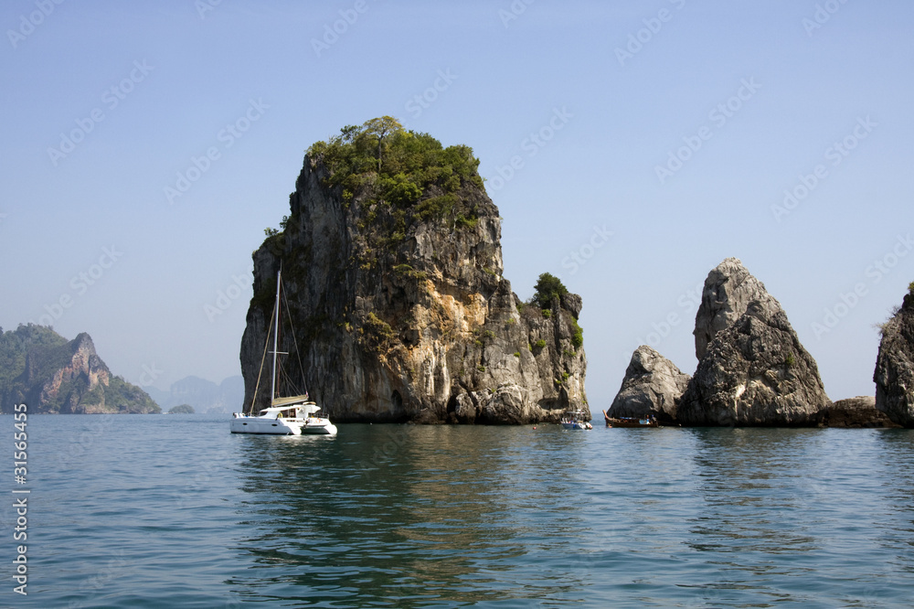 Catamaran and limestone outcrops, Krabi, Thailand