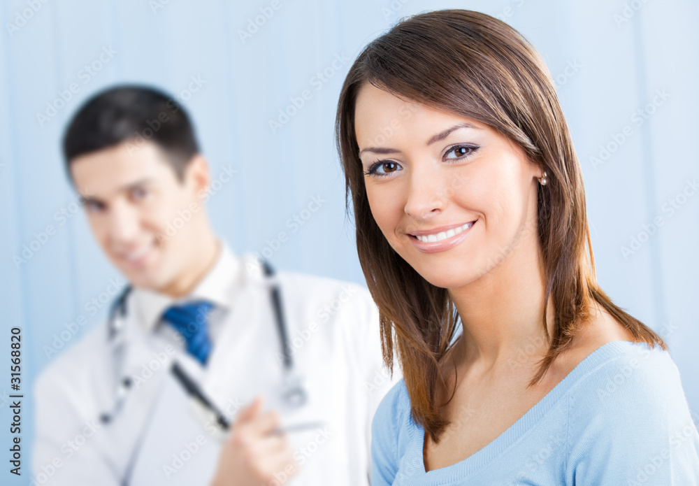 Happy female patient and doctor at office. Focus on woman. Happy female patient and doctor at office. Focus on woman.