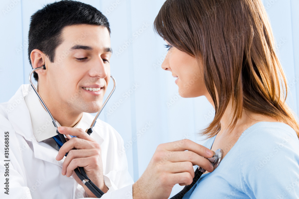 Doctor with stethoscope and female patient Doctor with stethoscope and female patient