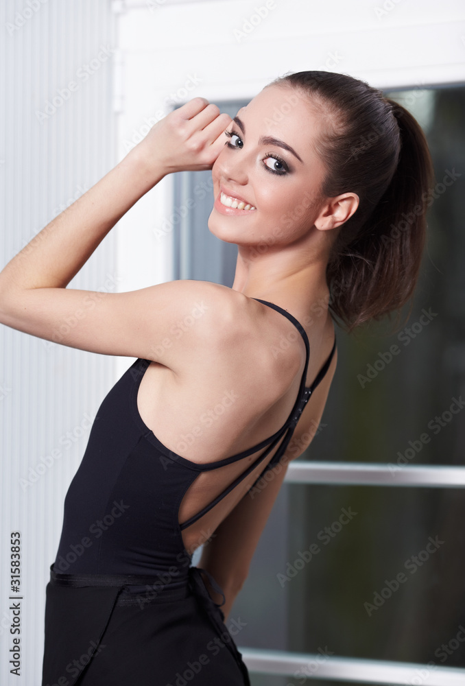 young ballerina is relaxing in class room young ballerina is relaxing in class room