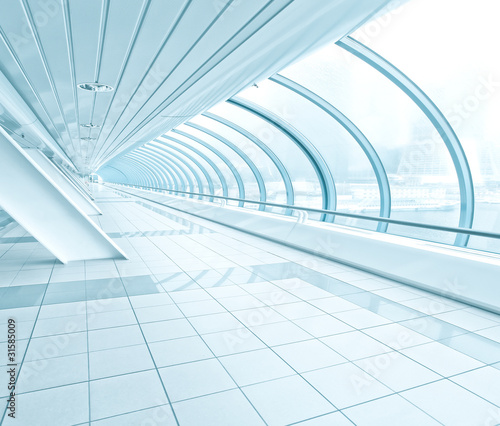 wide angle view of blue business hall inside airport