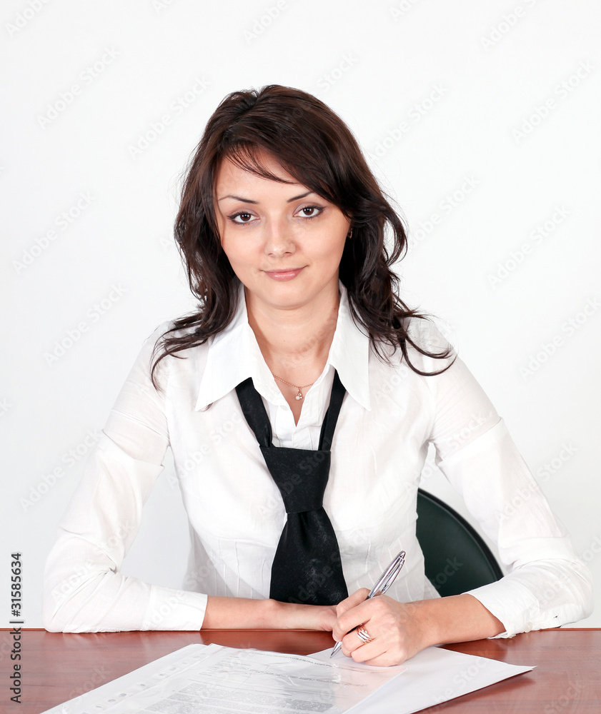 portrait of attentive businesswoman signing document portrait of attentive businesswoman signing document