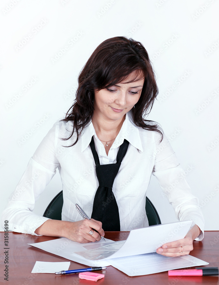 attentive businesswoman signing document attentive businesswoman signing document