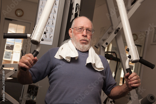 Elderly Adult Man Working Out in the Gym.