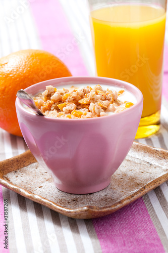 Breakfast with cereal, orange and orange juice