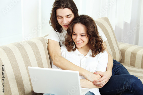 Couple on a couch, browsing
