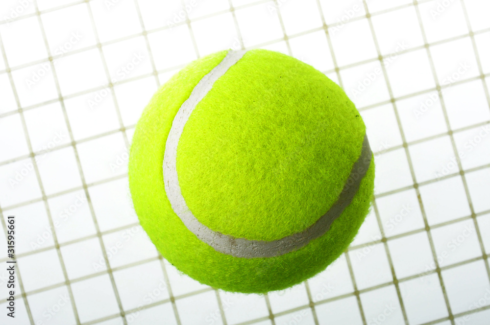 A tennis ball on net isolated on white background.