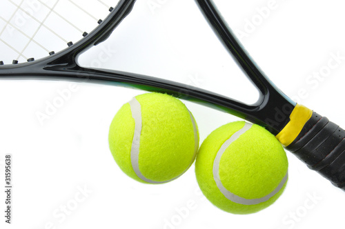 Two tennis ball on racket isolated on white background. © anat_tikker