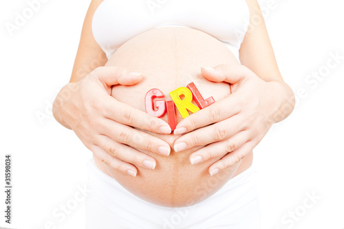 Pregnant woman hold in hand word girl