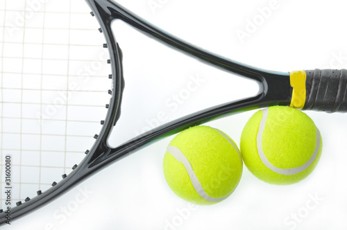 Two tennis balls and racket with isolated white background. © anat_tikker