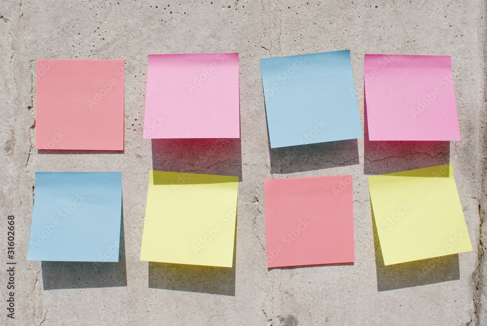 Sticky notes on the concrete wall