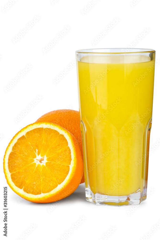 Drinking glass with orange juice and oranges near Drinking glass with orange juice and oranges near