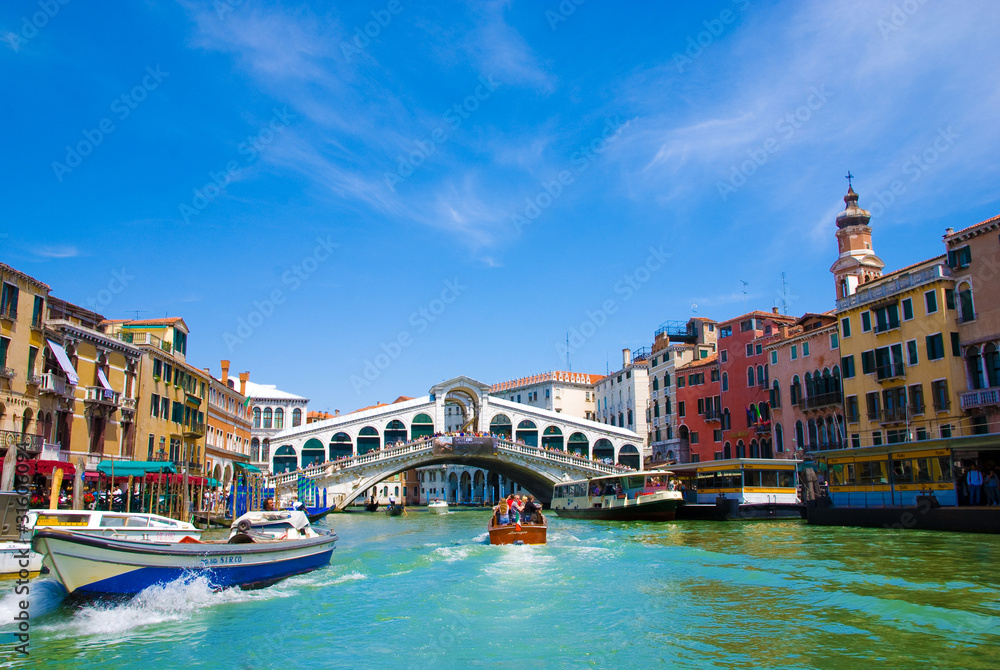 Venice Grand canal with gondolas and Rialto Bridge, Italy