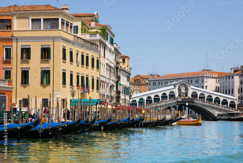 Venice Grand canal with gondolas and Rialto Bridge, Italy