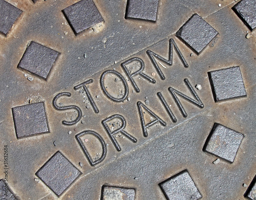 storm drain, vintage rain water manhole closeup,, street rain utilization diversity, rust street metal diversity