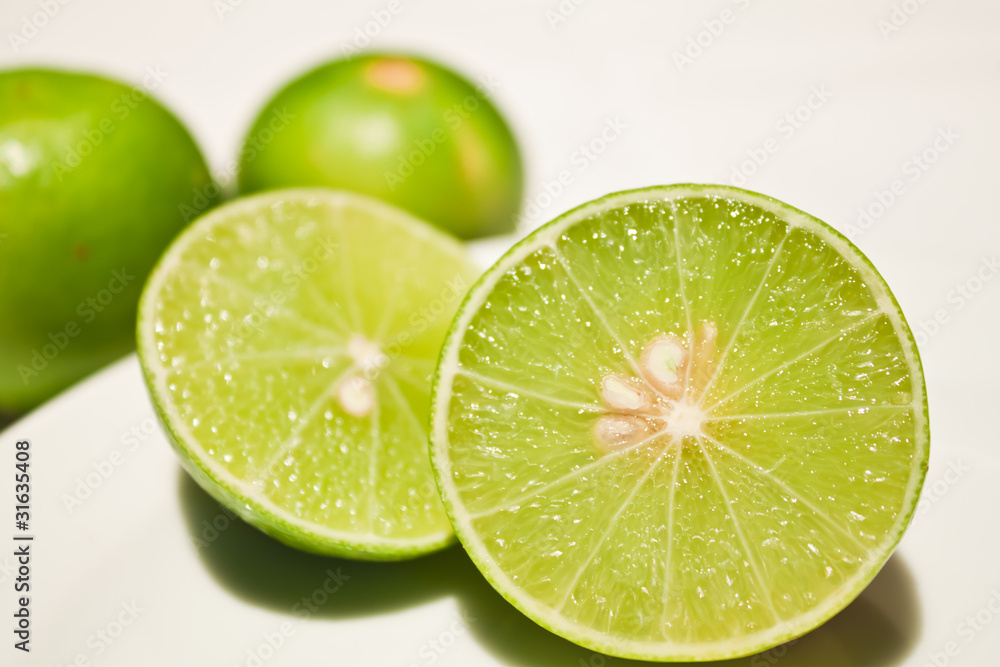 Fresh ripe lime. Isolated on white background Fresh ripe lime. Isolated on white background