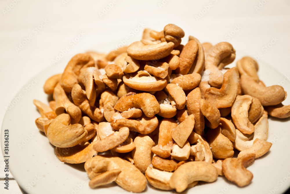 Cashew nuts on a white background. Cashew nuts on a white background.