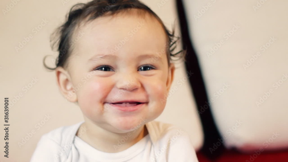 Happy baby boy playing with TV remote controller Happy baby boy playing with TV remote controller
