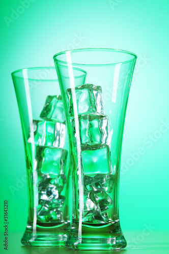 Glasses of water against gradient background