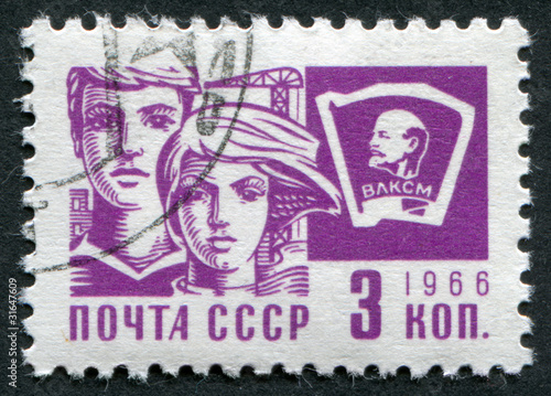 Postage stamp USSR 1966: A man and a woman and Komsomol sign