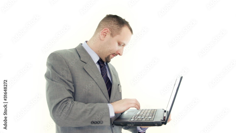 Businessman working on laptop, isolated on white Businessman working on laptop, isolated on white