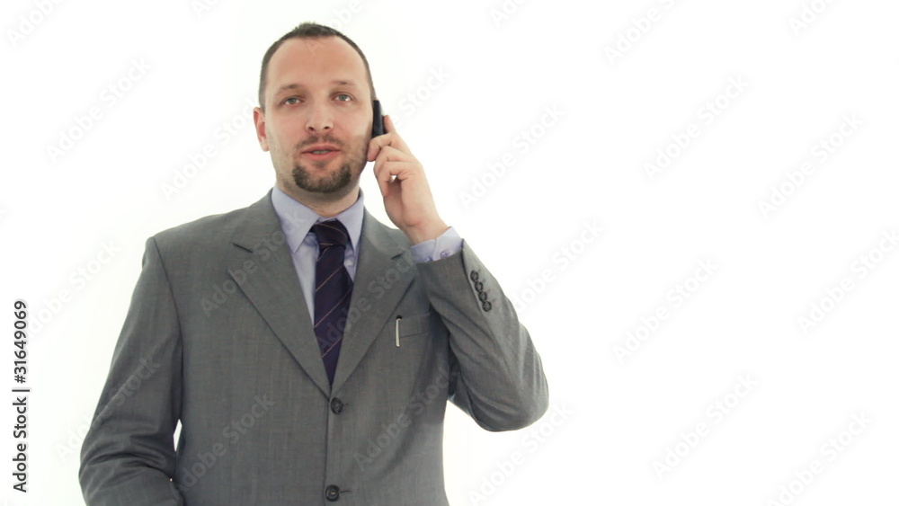 Businessman talking on cell phone, isolated on white Businessman talking on cell phone, isolated on white