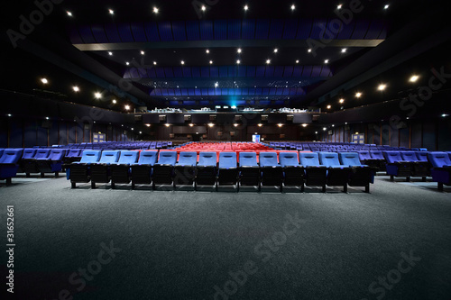 Empty arm-chairs are in hall of picturedrome photo