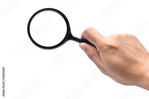 hand holds a magnifying glass with clipping paths