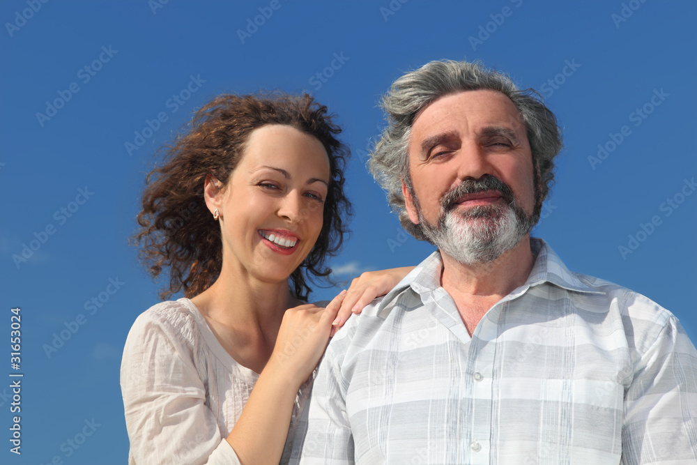 portrait of young woman embracing her father and smiling portrait of young woman embracing her father and smiling