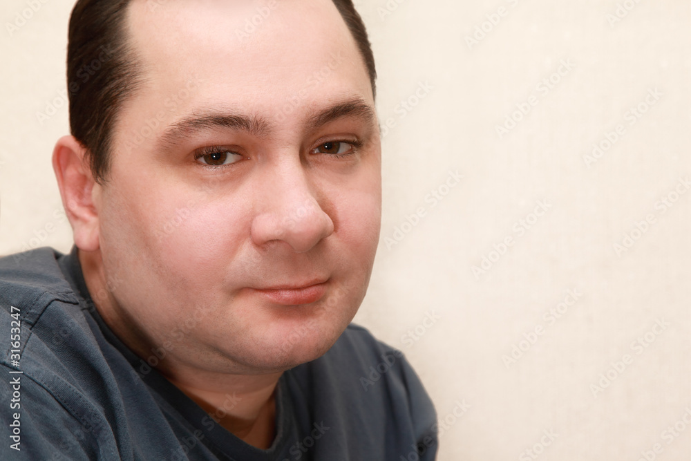 portrait of middle-aged quiet man in gray shirt portrait of middle-aged quiet man in gray shirt