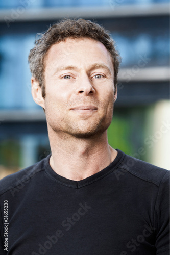 An outdoor portrait of a middle aged man