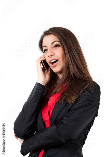 Businesswoman talking at the phone isolated on white