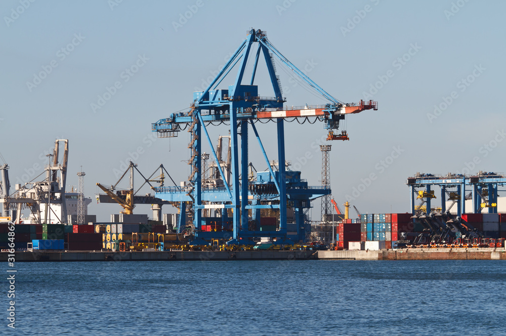 port with cranes and containers in Genoa, Italy