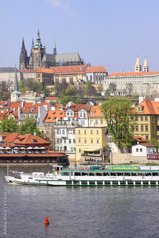 Obraz premium View on the spring Prague gothic Castle above River Vltava