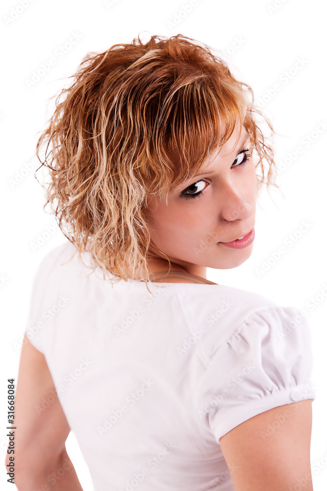 Beautiful and happy blond girl looking back to the camera Beautiful and happy blond girl looking back to the camera