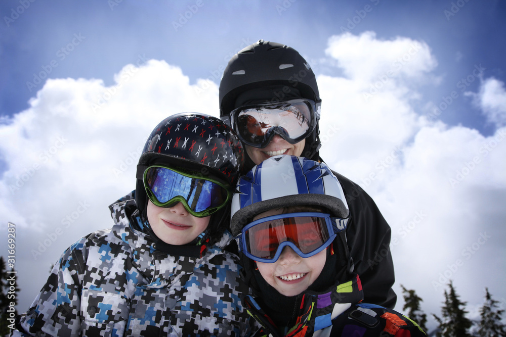 mother with two boys skiing mother with two boys skiing