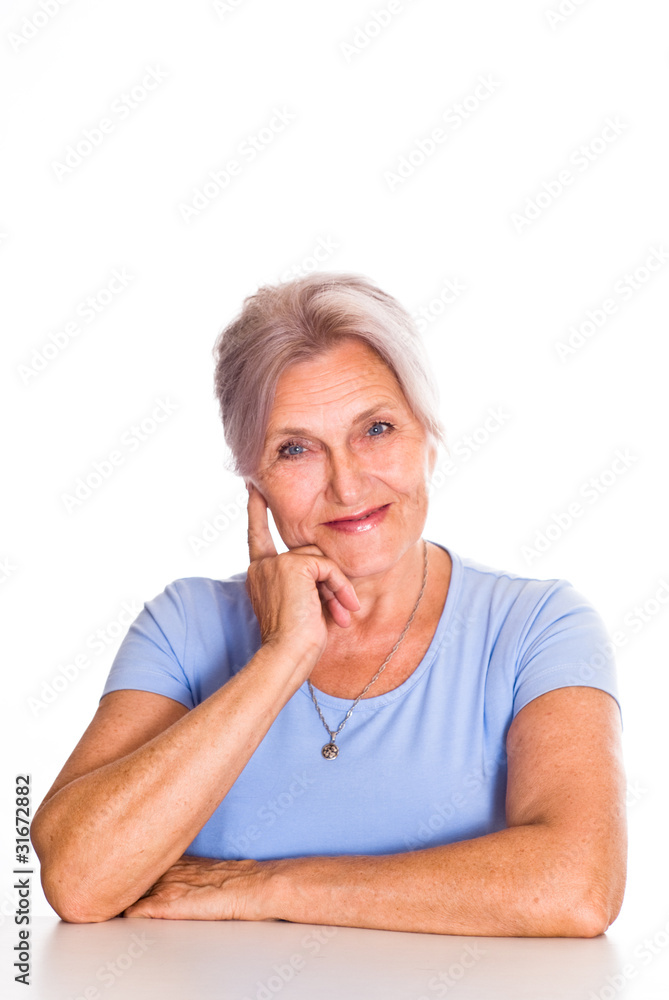 older woman in blue on a white older woman in blue on a white