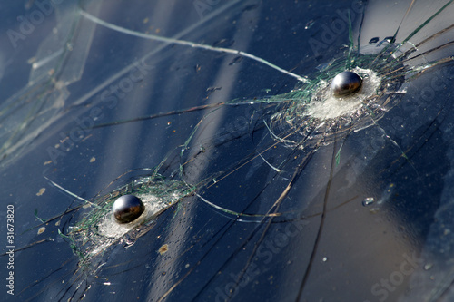 Glass  broken   bullets  shots © olegusk
